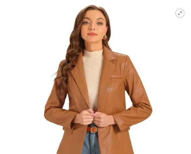 Caramel faux leather moto jacket used as the structured layering piece over knit and graphic tops